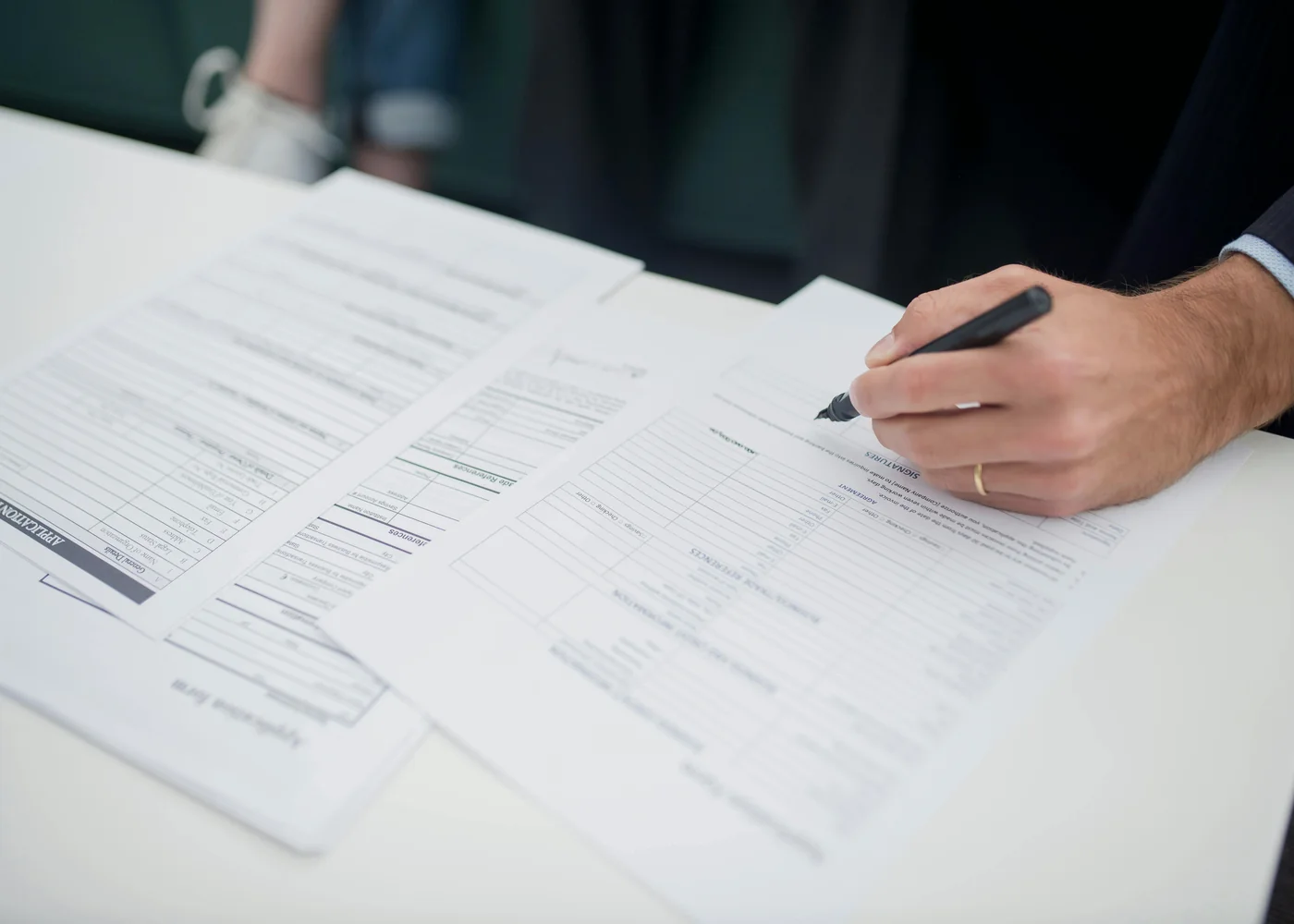 Insurance forms being completed for website and policy records